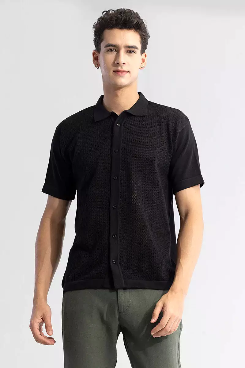 Black knit shirt with elegant and serene style.