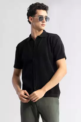 Black knit shirt with elegant and serene style.