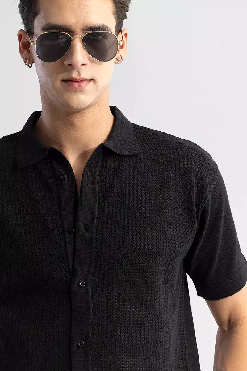 Black knit shirt with elegant and serene style.