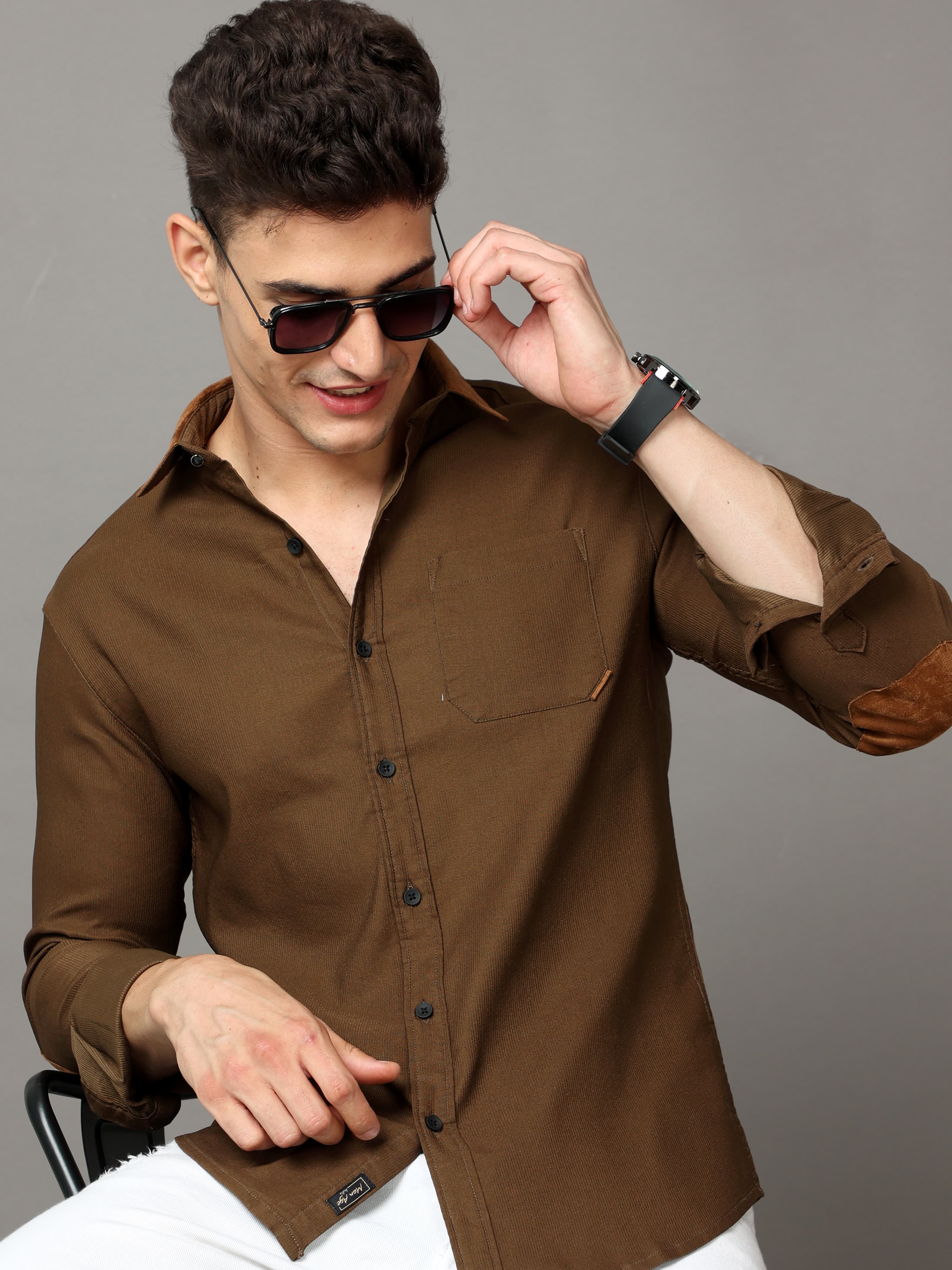 Brown self stripe corduroy shirt with leather contrast.