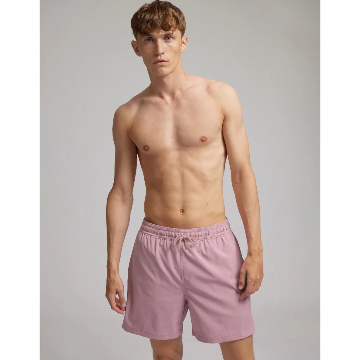 Colorful faded pink swim shorts from the Standard Classic collection.