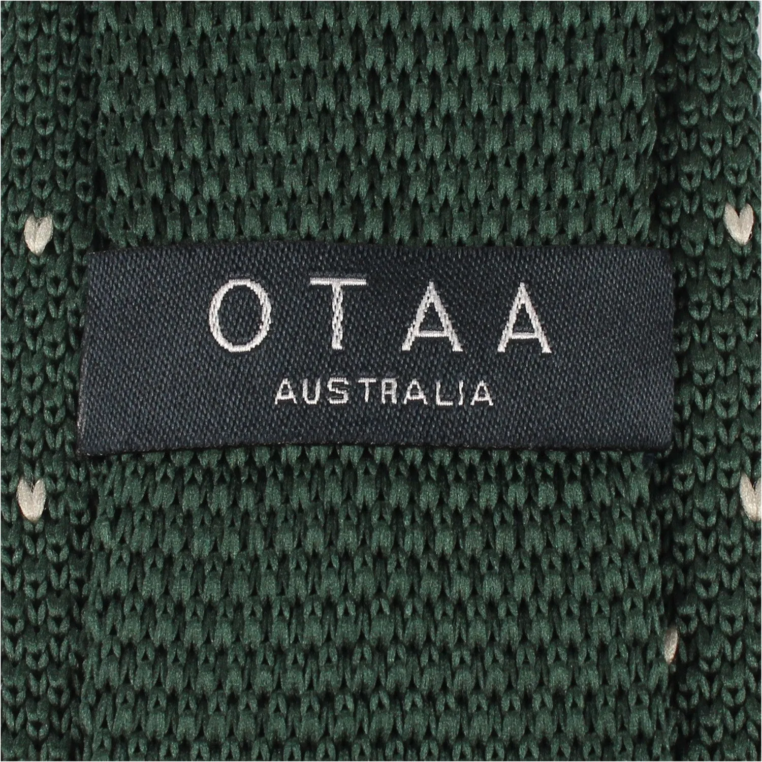 Green and white pattern knitted tie