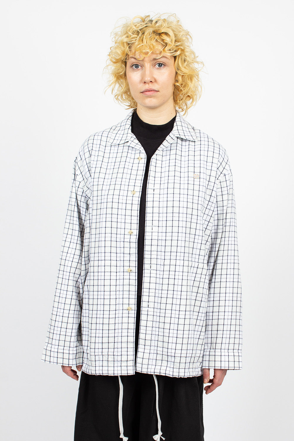 White and black flannel overshirt.