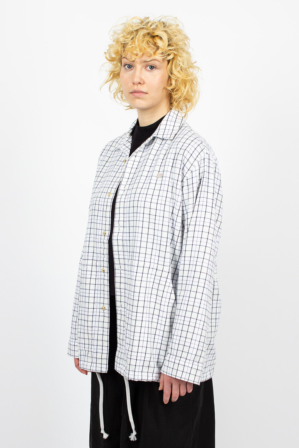 White and black flannel overshirt.