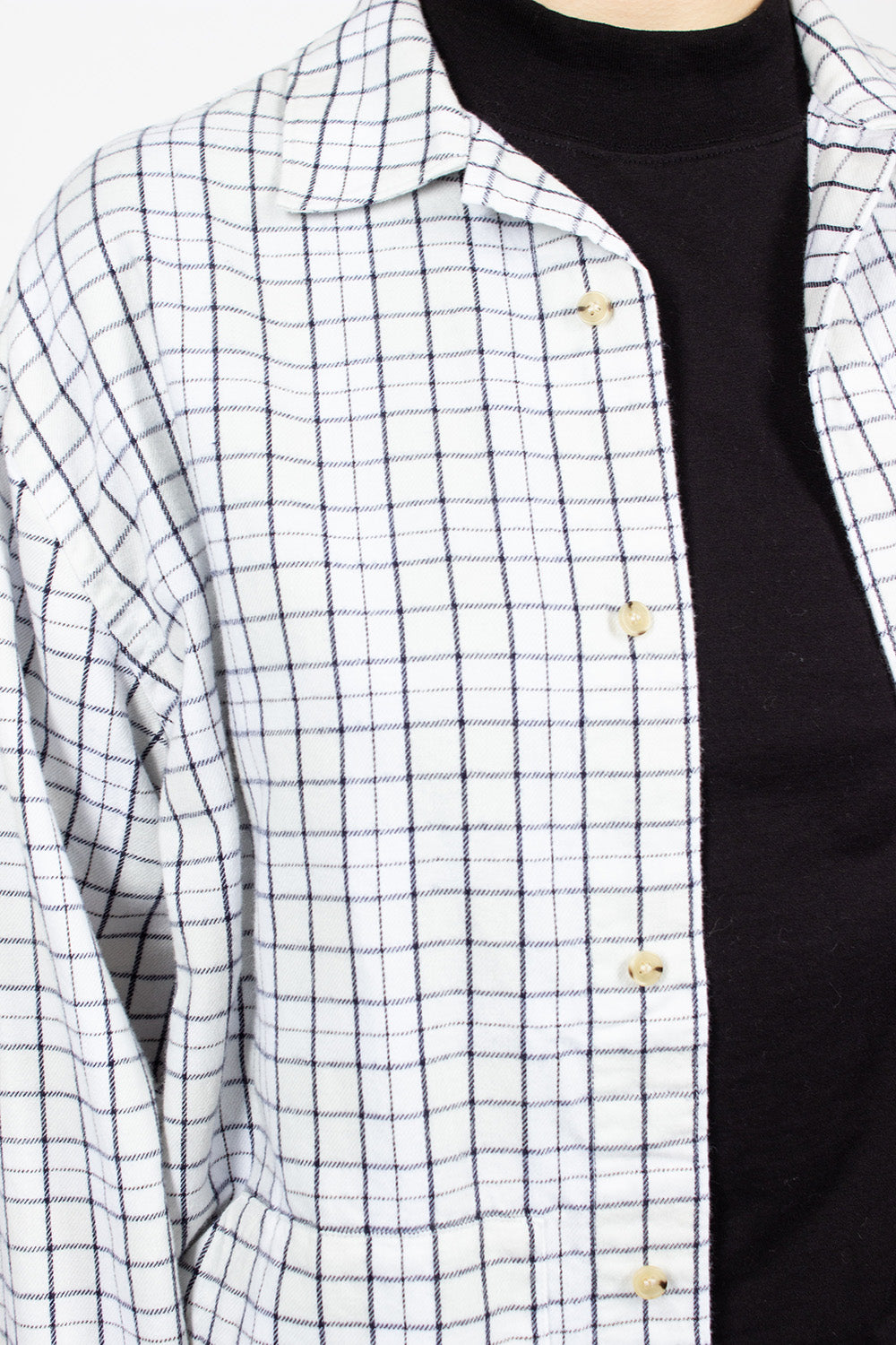 White and black flannel overshirt.