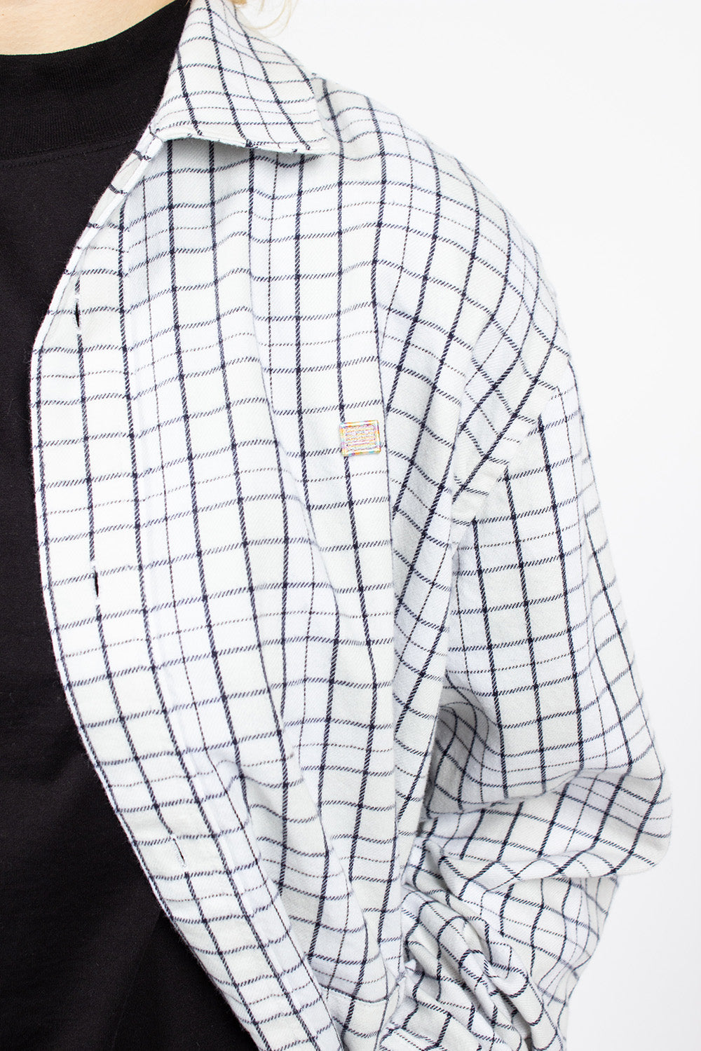 White and black flannel overshirt.