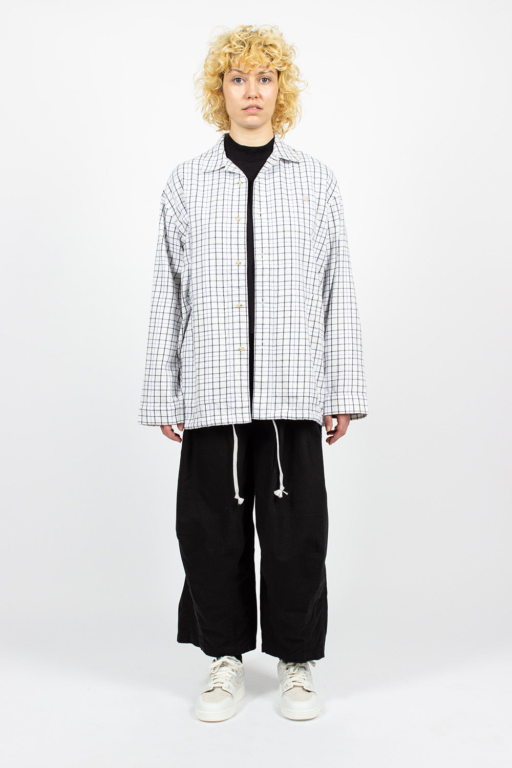 White and black flannel overshirt.